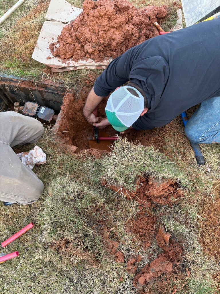 Person collecting soil sample in a container during outdoor field work or environmental testing